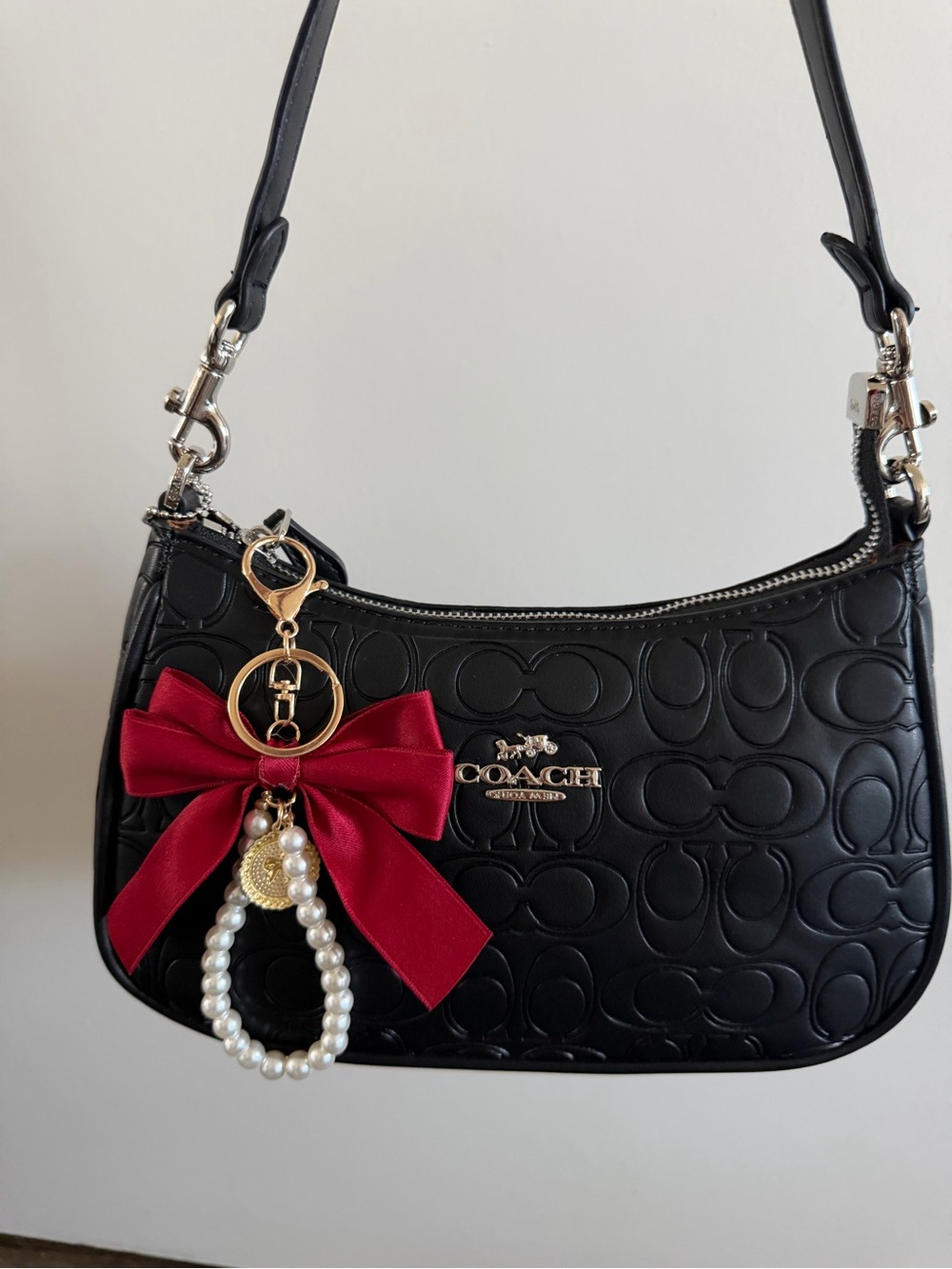 Coach Black Embossed Leather Shoulder Bag with Red Bow Charm